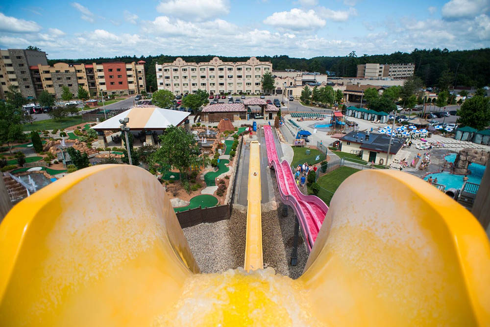 View from the top of one of the scariest waterslides in Wisconsin Dells with resort buildings in the distance.