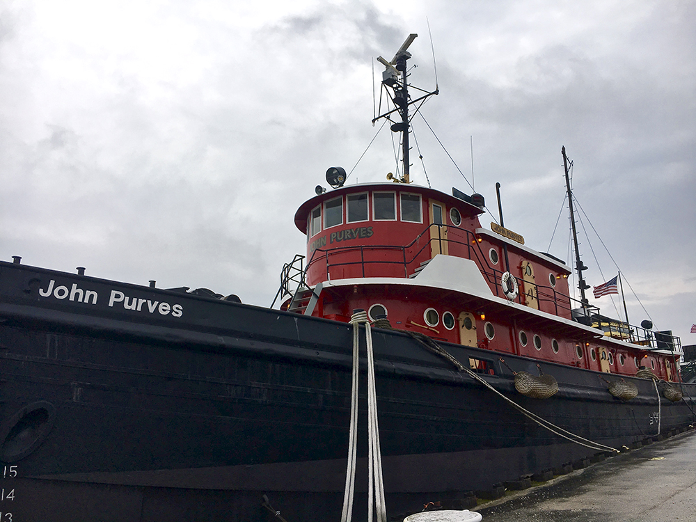 Red and black tugboat docked in Sturgeon Bay, Wisconsin.