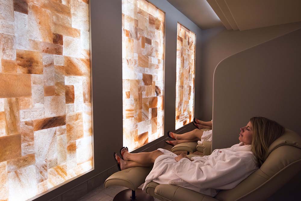 People relaxing in the salt therapy room at Sundara Inn & Spa.