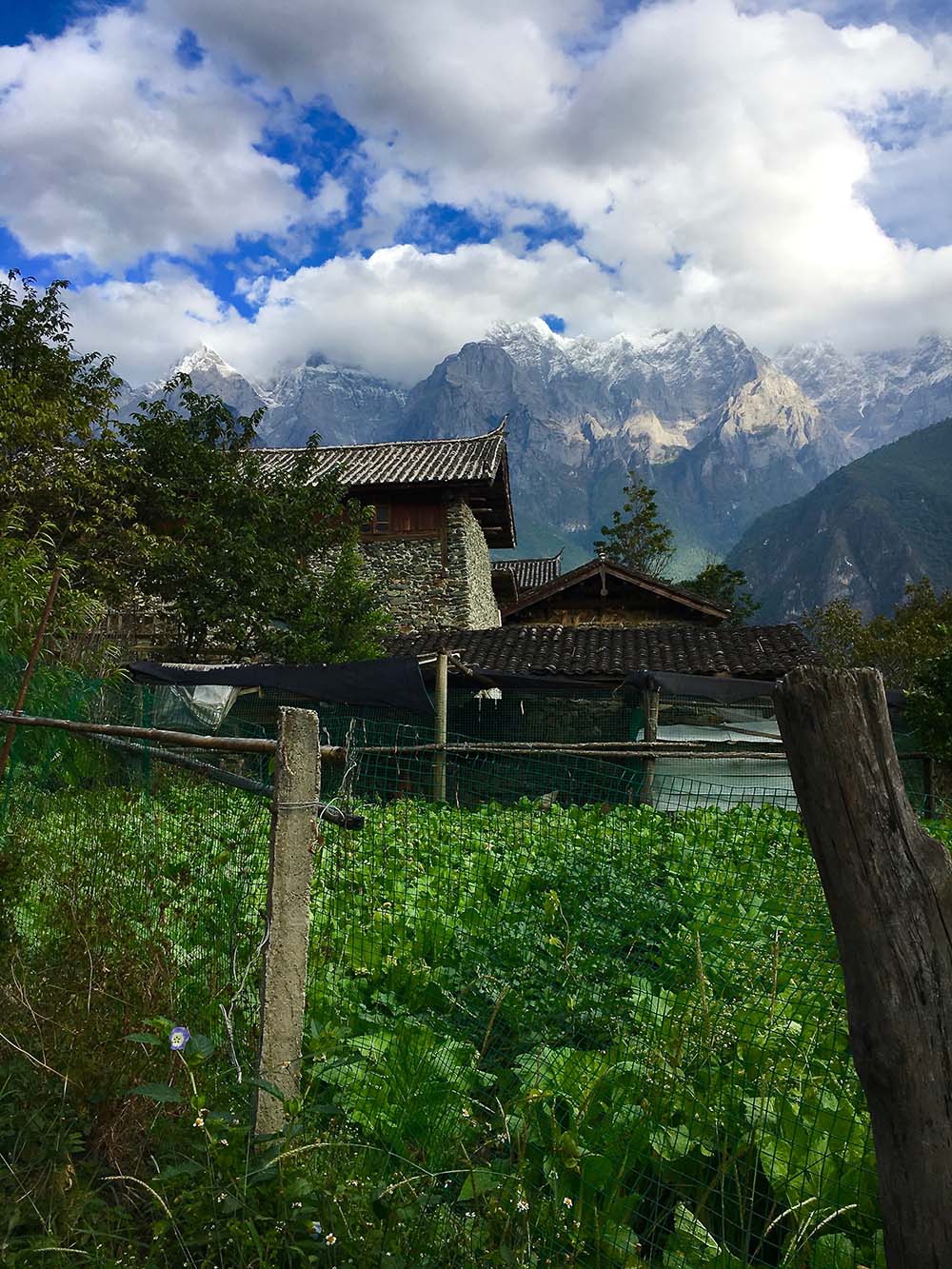 Chinese hut on mountainside at Tiger Leaping Gorge