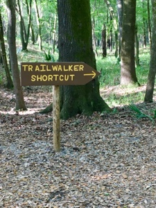 Sign reading "Trailwalker Shortcut" on Florida Trail heading to I-10.