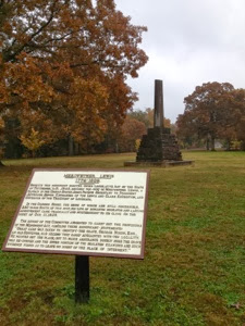 Stone marker marking Meriwether Lewis' burial site along the Natchez Trace.