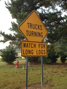 Sign along Natchez Trace saying Trucks Turning Watch for Long Logs.
