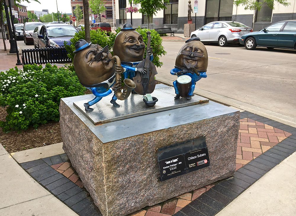 Humpty-Dumpty type sculpture on street in Downtown Eau Claire.