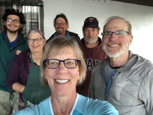 Six people standing on a porch in Superior, Arizona, taking a group selfie.