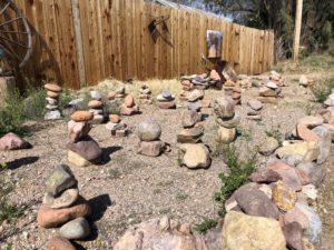 Side yard filled with tiny cairns in Patagonia.