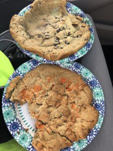 Two giant cookies as big as paper plates.