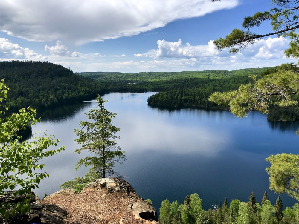 View of a lake in the Boundary Waters from a rocky outcrop.