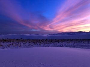 Sunset turns dunes at White Sands National Park a lavender hue.