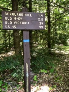 North Country Trail sign noting distances to various crossings en route to FR 326.