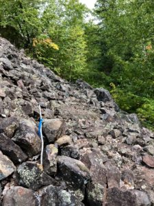 Mountain of rocks into which a hiking path is chipped, on the North Country Trail near Norwich Road.