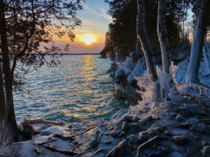Sunset over Lake Michigan in winter as seen from Cave Point, Door County.