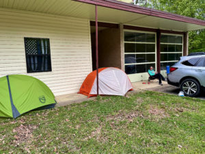 Two tents set up under an overhang near the Old Trace on the Natchez Trace.