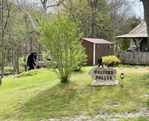Country home with two Bigfoot cut-outs.
