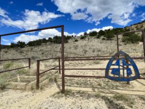 Gate with the Continental Divide Trail emblem. 
